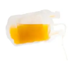 clear plastic medical bag with yellow liquid, laying horizontally