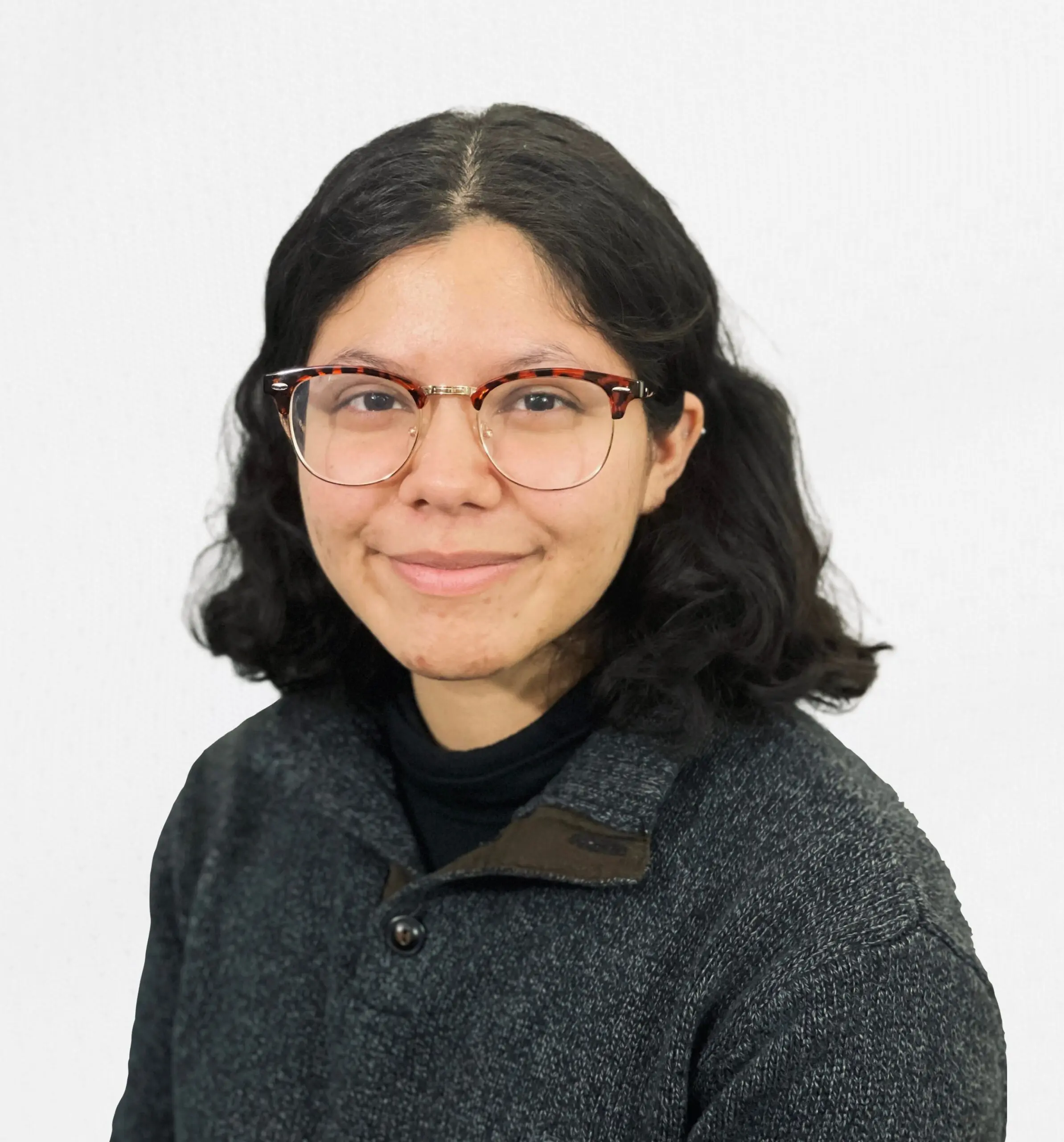 Briana Lopez-Patino Headshot hispanic woman with black hair and glasses
