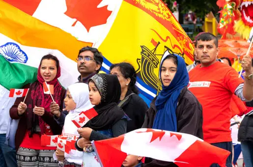 Canadian children with flags and headscarves