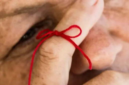 red string around finger