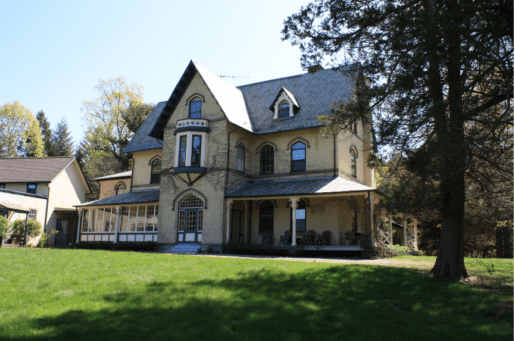 yellow ocre and beige building on green lawn