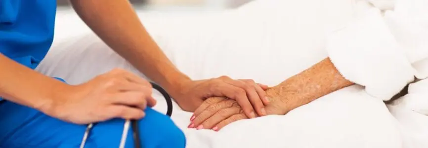 doctor holding patient hand