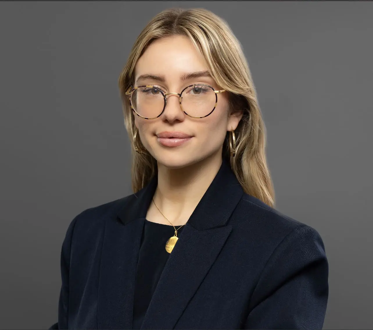 blond white woman with glasses
