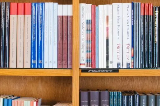 medical books stacked on wooden shelves