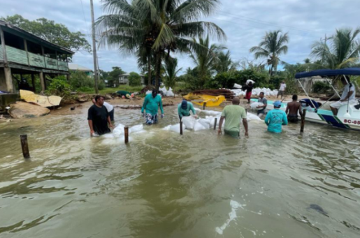men in flood on a river