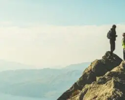 Couple summiting a mountain
