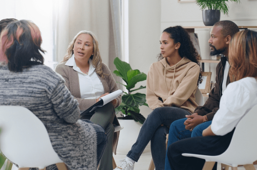 a diverse group of people discussing health care