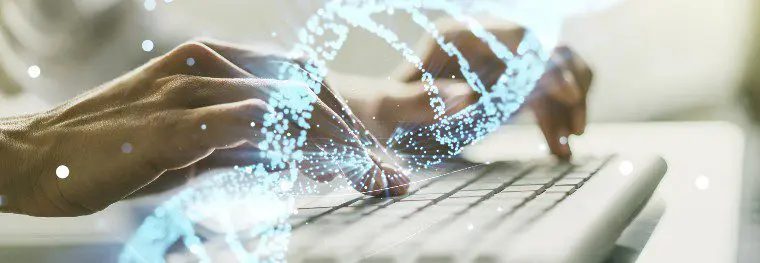 hands typing on keyboard with DNA overlay