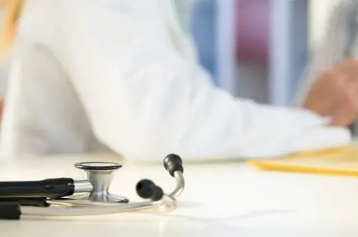 stethoscope with doctor in background