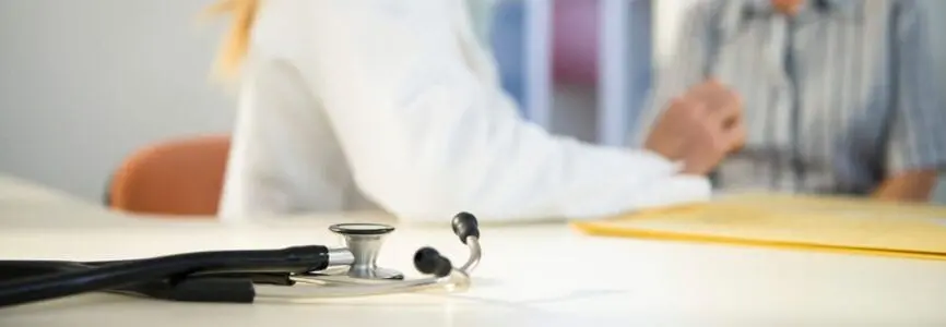 stethoscope with doctor in background