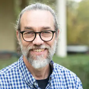 bearded, graying white man with glasses