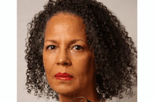 African-American woman with curly hair and red lipstick