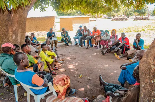 circle of Nigerian people in discussion