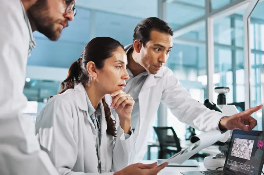 group of young asian and hispanic scientists