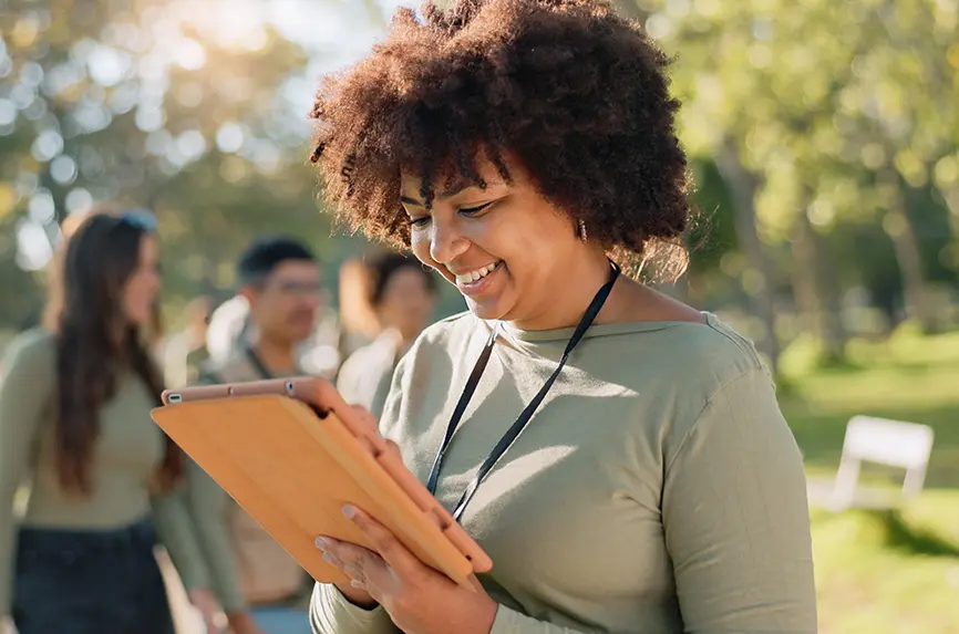 young african american woman reading on an ipad