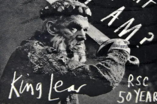 stamp of king lear holding sword from long ago
