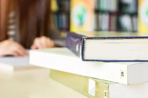 pile of books on a table