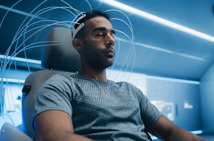 young man with eeg headset with wires