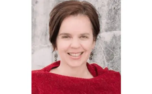 White woman with brown hair in red shirt