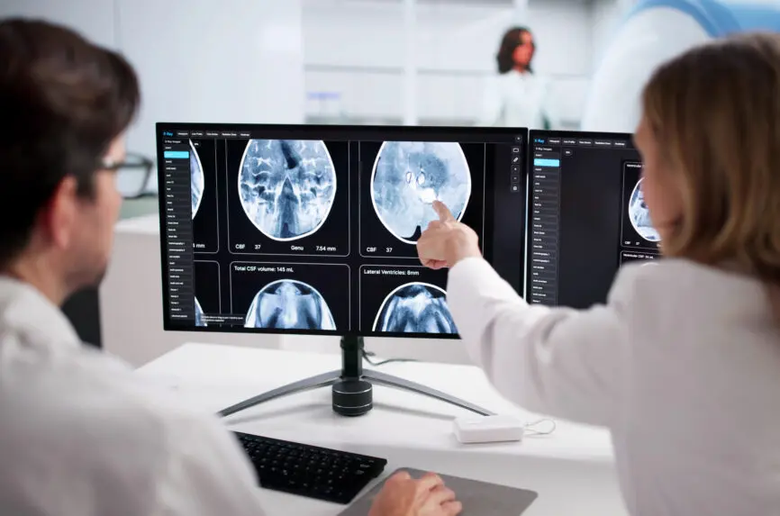 Expert Neuro Radiologist Analyzing MRI Brain Scan Using Cutting-Edge Technology.