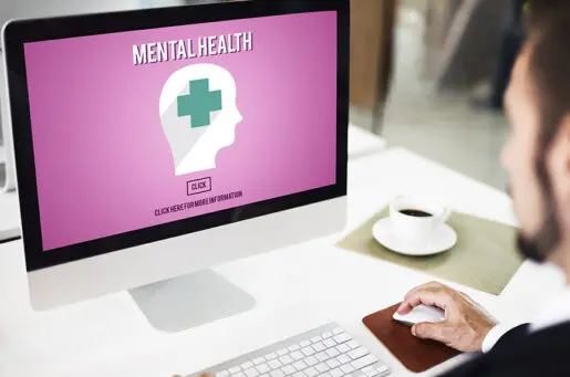 computer screen that says mental health with a graphic of a human profile