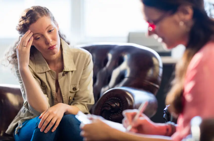 Psychologist having session with her patient in office