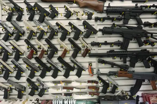 photo of a line of guns for sale