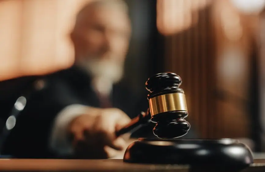 closeup of gavel held by a judge