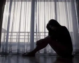 silhouette of woman in front of window