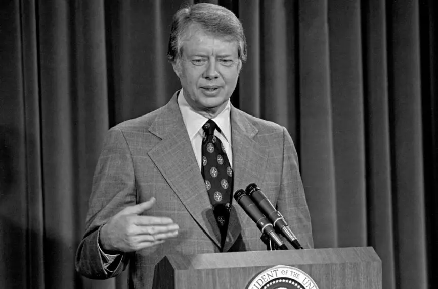 black and whilte photo of white man in suit