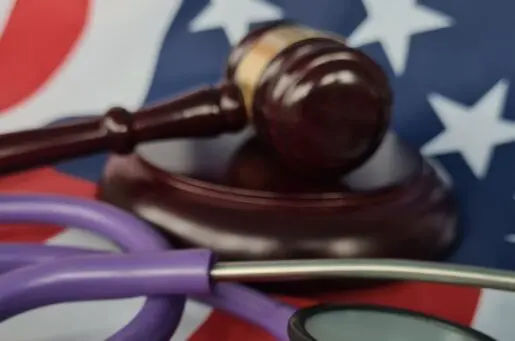 gavel, stethoscope on american flag