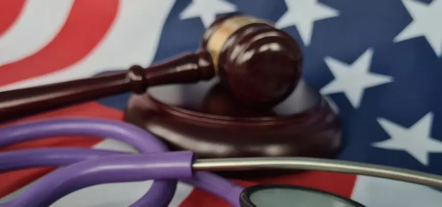 gavel, stethoscope on american flag
