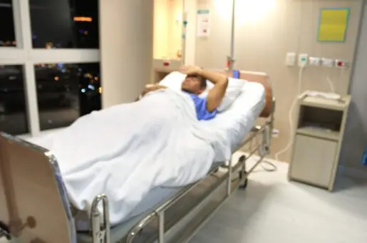 Black man in hospital bed