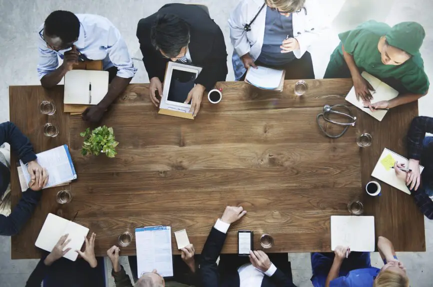 clinicians meeting around a table