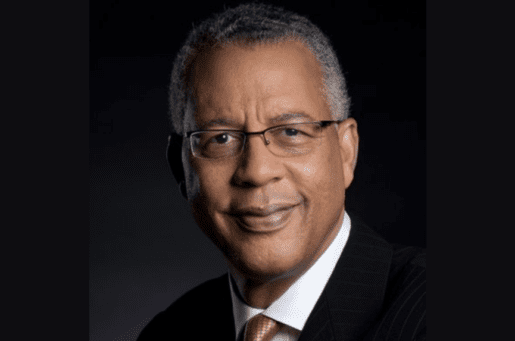 smiling black man with glasses and short graying hair