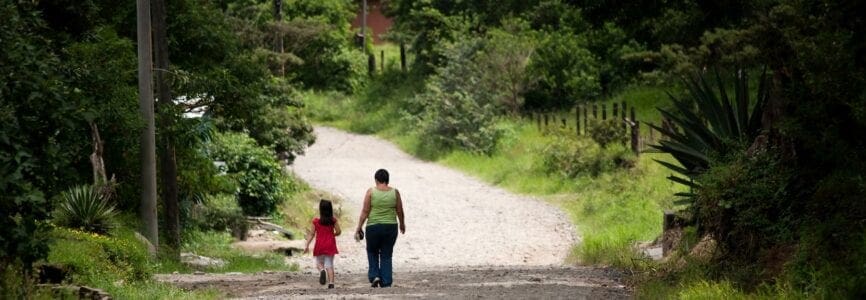 Woman and child walking in scenic Costa Rica