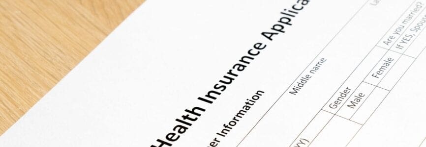 Health insurance application form wait to fill information on desk background