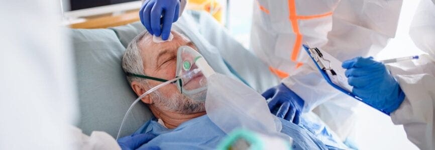 An infected patient in quarantine lying in bed in hospital, coronavirus concept.