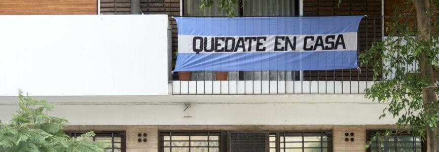 CABA, Buenos Aires / Argentina; June 28, 2020: Argentine flag with the message Stay at home, in the context of the pandemic and the quarantine to prevent the spread of coronavirus disease, Covid-19