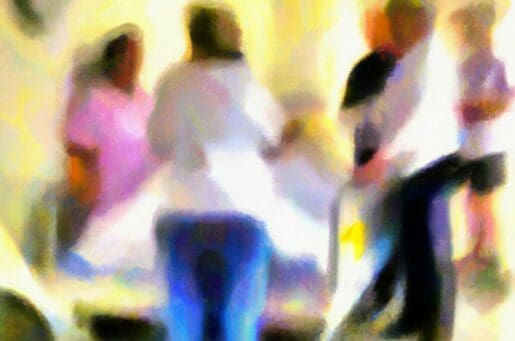 blurred illustration of people around hospital bed