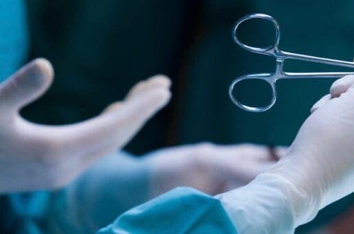 surgeon holding scissors