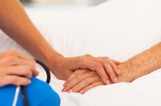 doctor holding patient hand