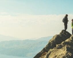 Couple summiting a mountain