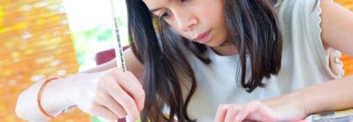 young girl writing