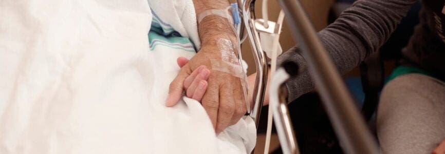 holding hands in hospital