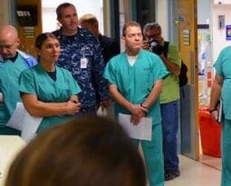 people in scrubs standing in a circle