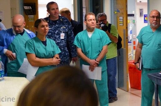 people in scrubs standing in a circle