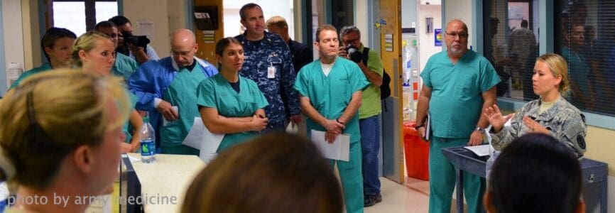 people in scrubs standing in a circle