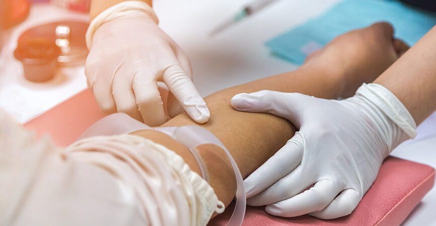 Nurse preparing injection to patient's arm for blood drawing sample for blood test the health examination in hospital
