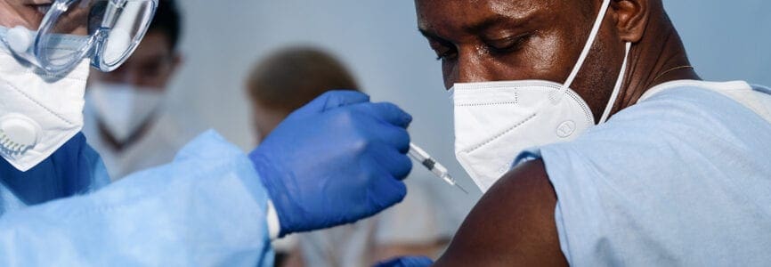 African American male receiving vaccine